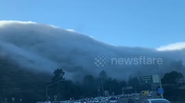 Stunning wall of fog rolls over mountain in Sausalito, California