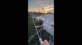 Russian daredevil runs across a high bridge and then bungee jumps off of it