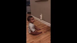 Baby can't stop laughing at dad while he tries to teach him safety