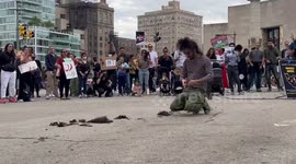 Man cuts his hair off in protest for Mahsa Amini in New York, USA