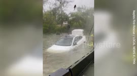 Fire crew in Naples, Florida rescues woman stuck inside submerged vehicle