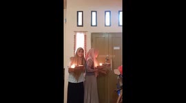 The girl accidentally set her handkerchief on fire while preparing a surprise for a friend!