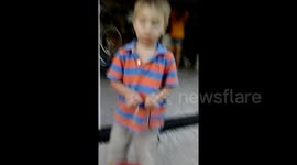 Boy tries to eat snake