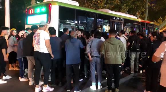 Residents lift bus up to free man trapped underneath in China - Buy ...
