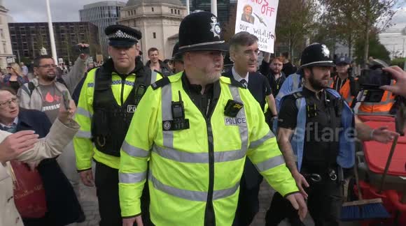 1.8M views on Twitter: MP Jacob Rees-Mogg HECKLED and CHASED by protesters and bundled away by cops as he arrives at Tory Party Conference in Birmingham