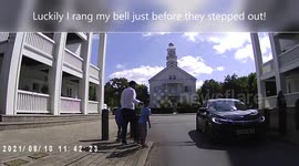 As I cycle along a father pushes his son into the road. Near miss!