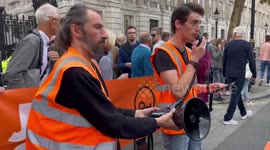 Alex De Koning, spokesperson for Just Stop Oil delivers a speech outside Downing Street, London, England, UK