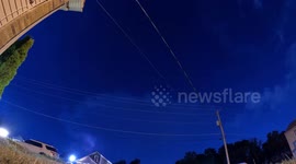 Watch as a severe thunderstorm capable of producing a tornado passes directly overhead at night