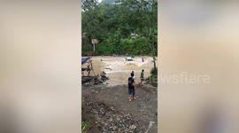Daredevil drivers brave overflowing river during caravan trip in the Philippines