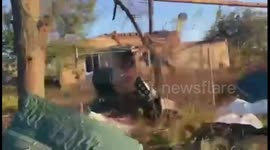 Aid brought to villagers who remained in town only just reclaimed by Ukraine