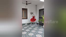 A cat sleeped very well portable chair when House owner go to some where.