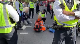 Just Stop Oil activists glue themselves to the road outside Baker Street station