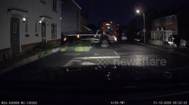 Dashcam footage captures moment truck collects skip from driveway in Stockport