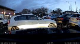 Dashcam footage captures a woman in BMW driving irresponsibly in a B&M car park in Stockport