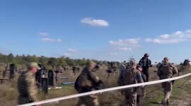 The police exhumed the first 20 bodies at the mass burial site in Lyman