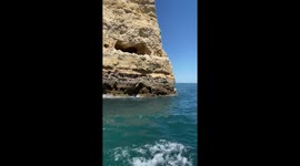 Riding on a boat across the Algarve caves. Beautiful view from the ocean