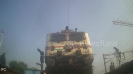 Crazy moment rail worker risks his life to save old man crossing train track