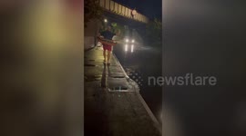 UK dad who is sick of floods near his house decides to 'embarrass the council' by taking a dip in the puddle - in a rubber ring