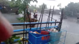Homes and roads flooded as Tropical Depression Maymay nears northern Philippines