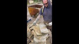 Man gracefully turns stone into a dazzling triangle after breaking it with a hammer