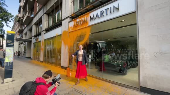New Aston Martin paint job: Just Stop Oil protesters cover Park Lane branch with orange paint