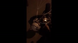 Pilot who ejected from warplane lies on ground close to burning building in Yeysk, Russia