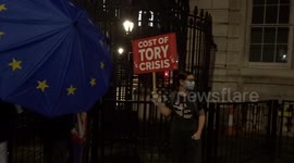 The Lunatics Have Taken Over the Asylum outside 10 Downing Street as Liz Truss resigns as UK prime minister