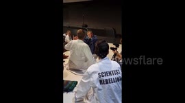 Climate activists glue themselves to floor of Volkswagen facility in Germany