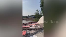 Riverside house crumbles after water erodes its foundations