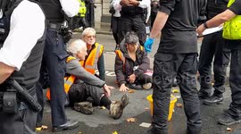 Just Stop Oil protesters glue their hands to the road in Holborn, London