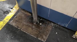Leyton Station despite having a roof is hit badly by heavy rain as it pours through holes and onto the platform