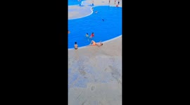 Man, chilling by the pool, HEROICALLY RUSHES to a drowning kid's rescue