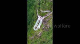 Tourists Enjoying Glass Trestle On Baler Mountain in Guilin, Guangxi, China