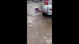 One year old girl plays and cuddles with her new cat that she found on our farm.