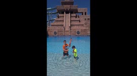 Children playing with water pistols at water park in Turkey