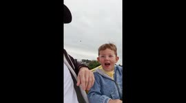 Kid on fairground ride