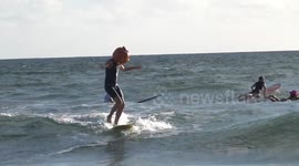 Florida surfers in Halloween costume hold a frightfully funny beach party