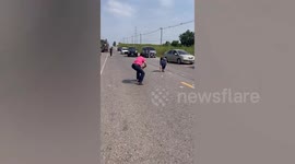 Kind residents help pick up cash scattered on road in Thailand