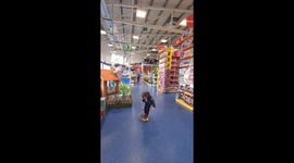 Kid using toy rocket I smyths store