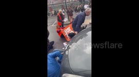 Passerby drags Just Stop Oil activist out of road in London's Shoredtich