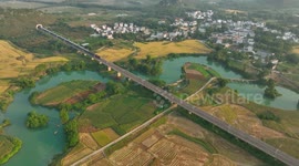 A Train Moving Through Farmland in Nanning, China