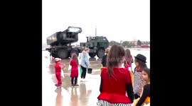 Ukrainian troops use US-gifted rocket launchers to pass out CANDY to joyous children in Donetsk