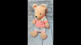Cute knitted bear named Richi looks for its friends. Just take a look at its sweet suit