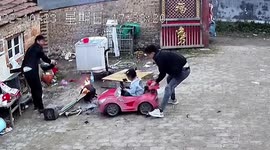 Quick-thinking father grabs hot pot seconds before daughter in toy car drives into it