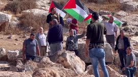 Palestinian demonstrators participate in the weekly a protest against settlement in the village of Beit Dajan