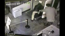 Man climbs into security scanner on conveyor belt at train station