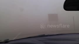 Severe dust storm engulfs car
