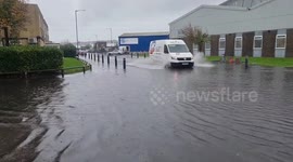 Road flooded after night of heavy rain on Sussex coast, England