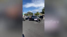 Motor racing fanatic drives replica F1 car to picnic lake in France