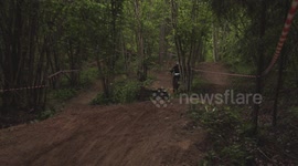 Crashing into the trees at high speed for a downhill bike rider